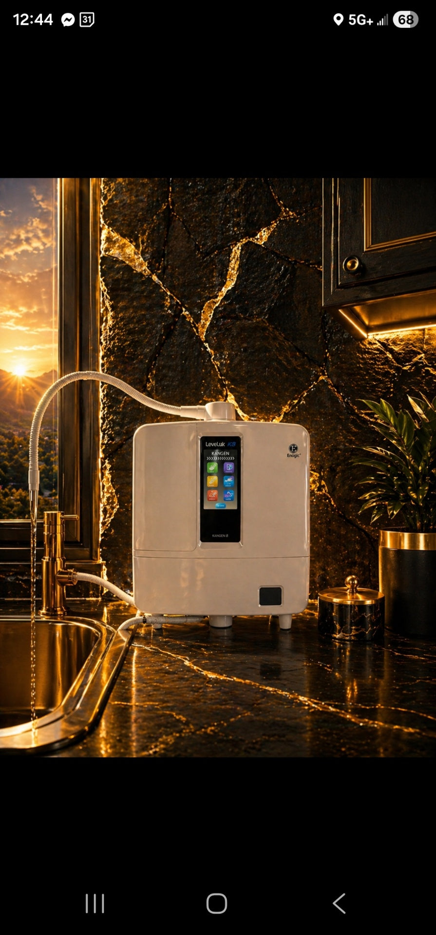 Kangen LeveLuk K8 water ionizer on luxe gold-veined stone counter at sunset.